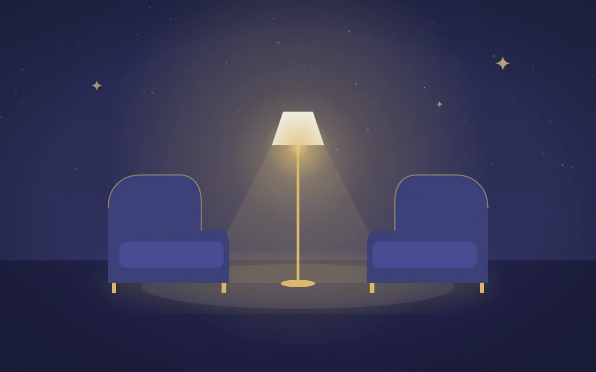 Illustration: two armchairs facing each other under a lit lamp